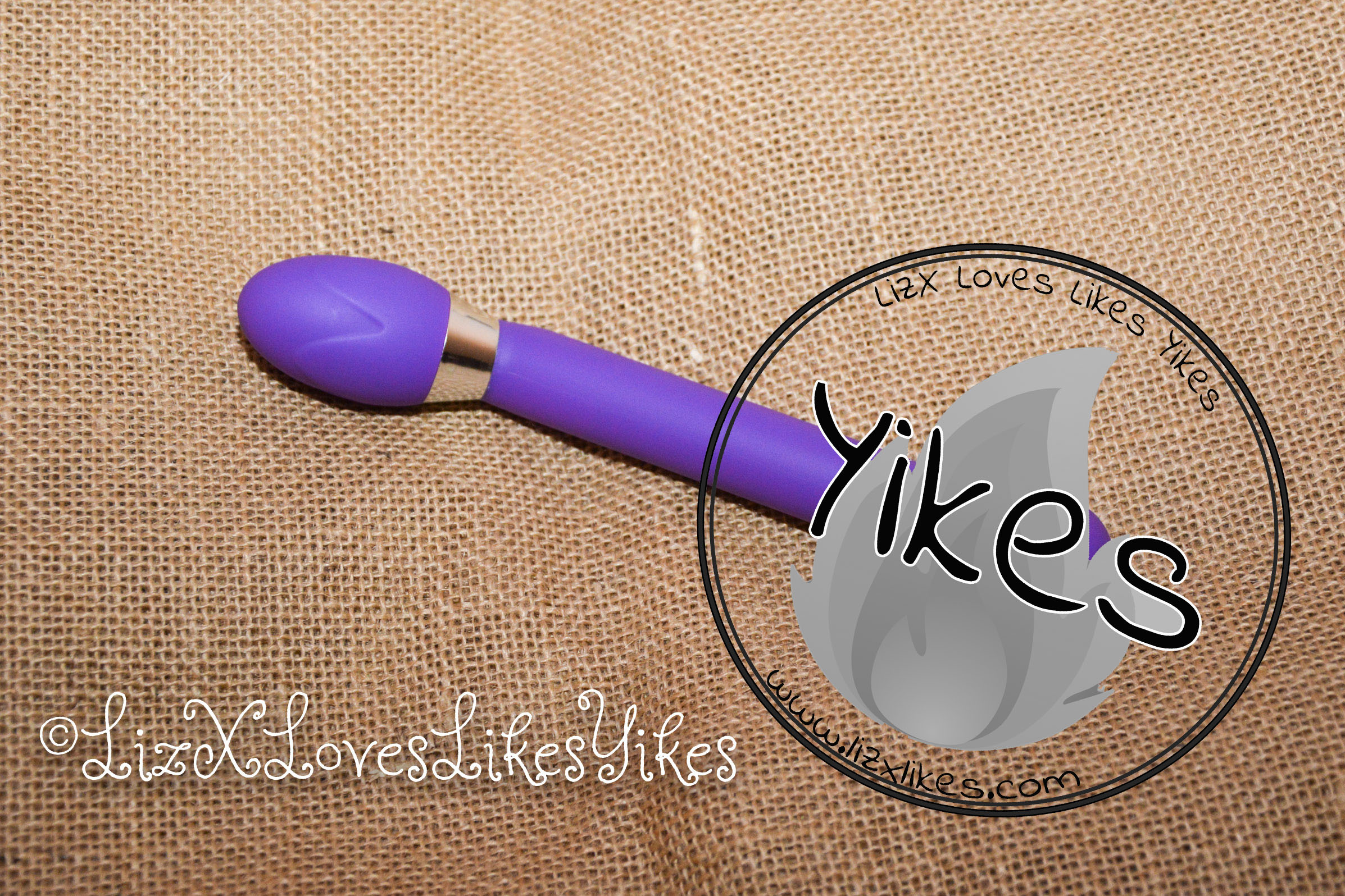 Man Nuo G-spot Vibrator Purple The vibrator with a 'Yikes' stamp on it.