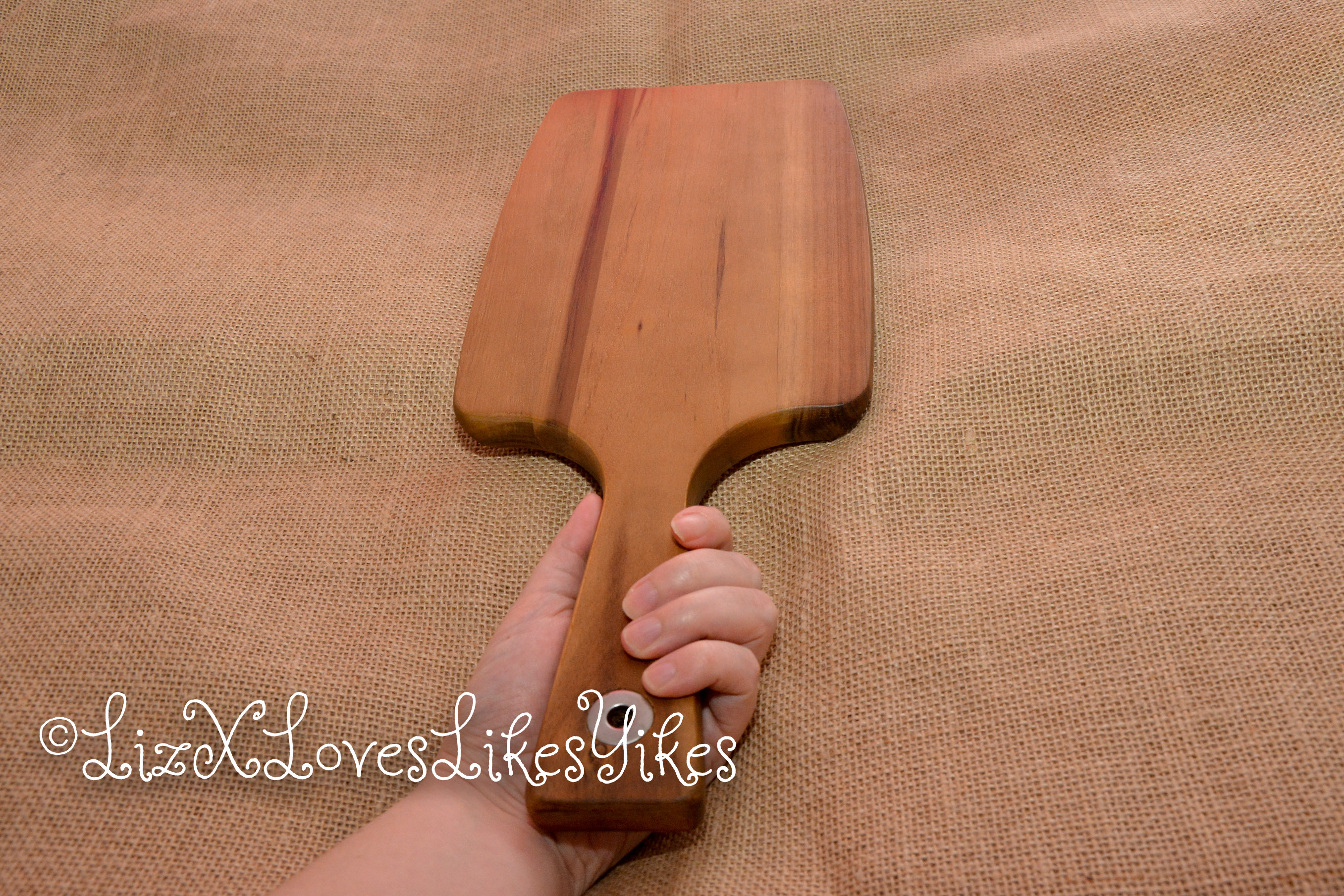 Paddle - DIY-BDSM - Aldi Copyright LizxLovesLikesYikes The paddle held in LizX' hand