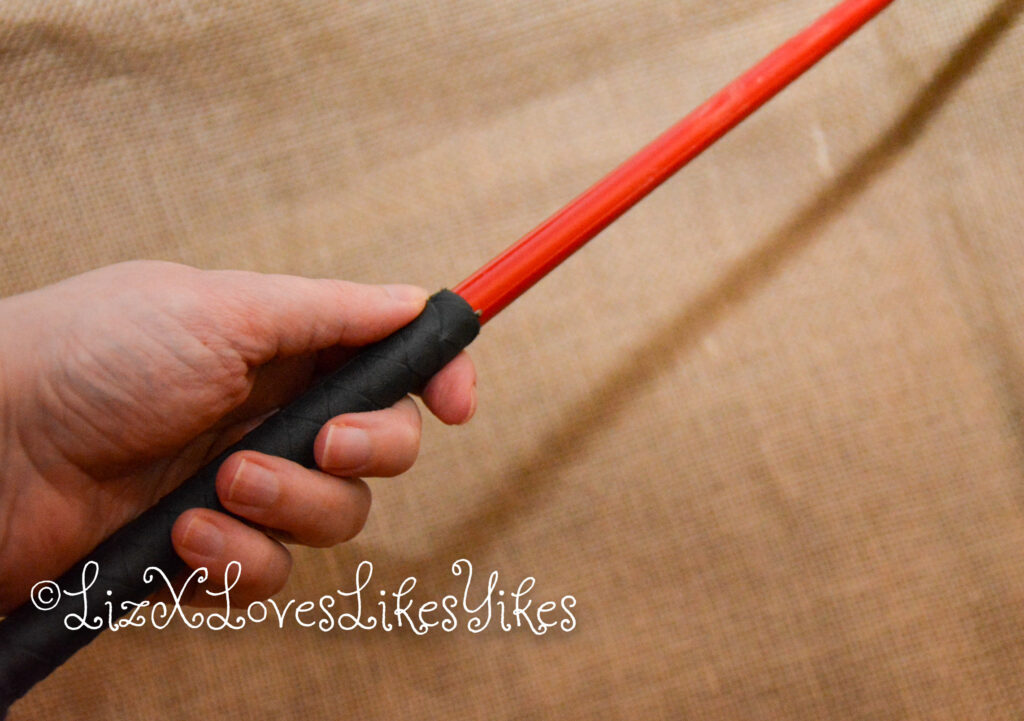 'El Bastardo' - caning implement by Mchurt.eu Picture of whip is Liz' hand Review by LizXLikes.com Copyright LizXLikes