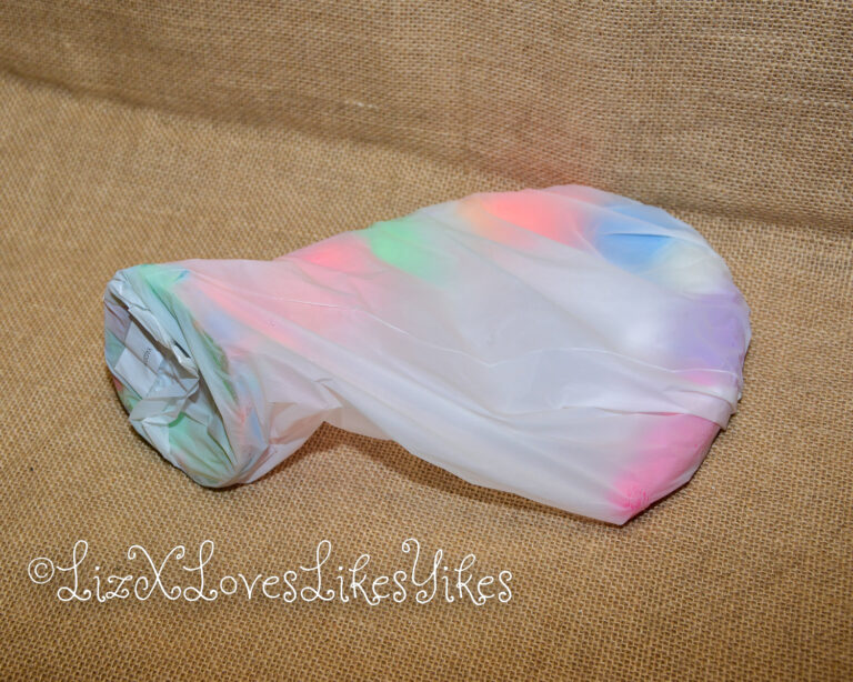 The toy in its plastic wrapping. Review of the Depth Training Unicorn Tentacle Anal Dildo Luminous BigShocked.com Copyright Liz BlackX