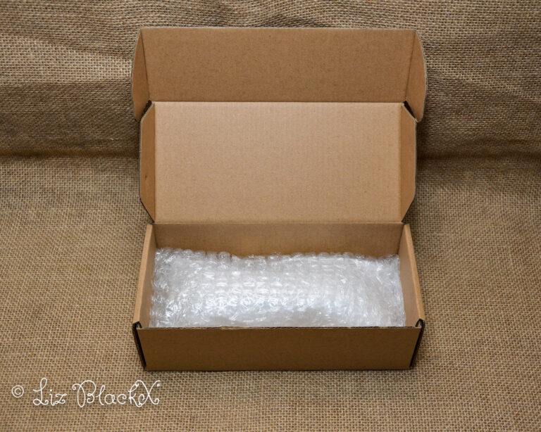 Unwrap the Night: Funzze Glow-in-the-Dark Glass Dildo Review Copyright Liz BlackX